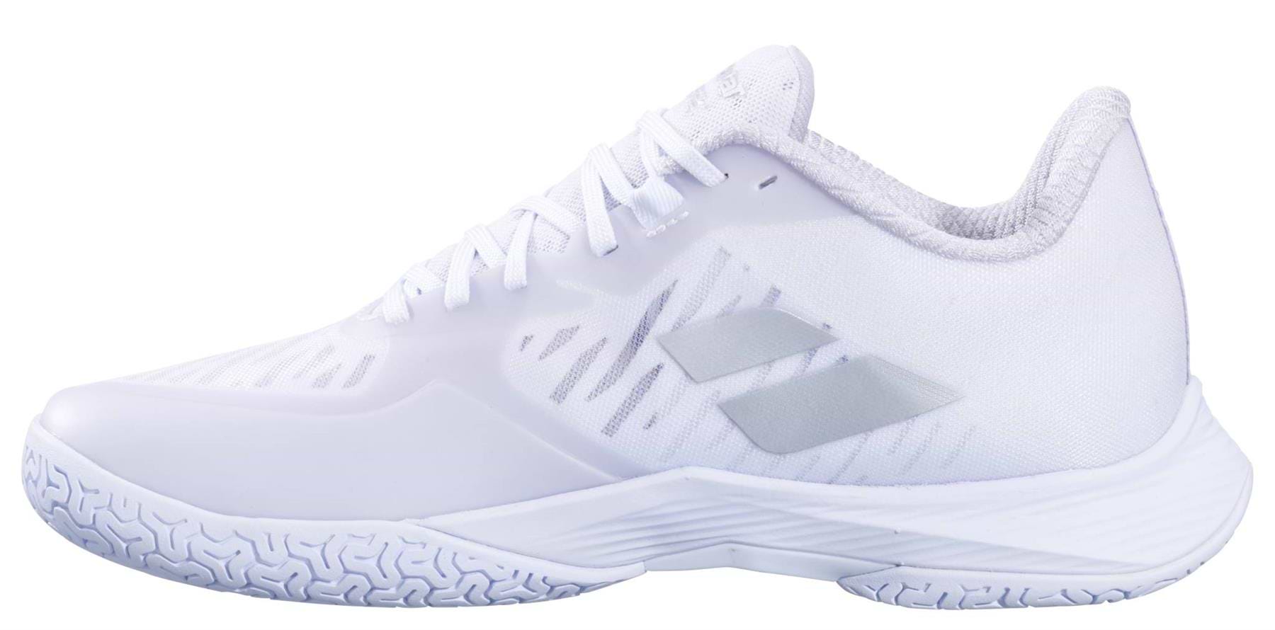 The Babolat Shadow Tour 5 Womens Badminton Shoes in white feature a low-cut design, textured sole, subtle grey side stripes, and white laces—offering sleek style and peak performance for women on the badminton court.