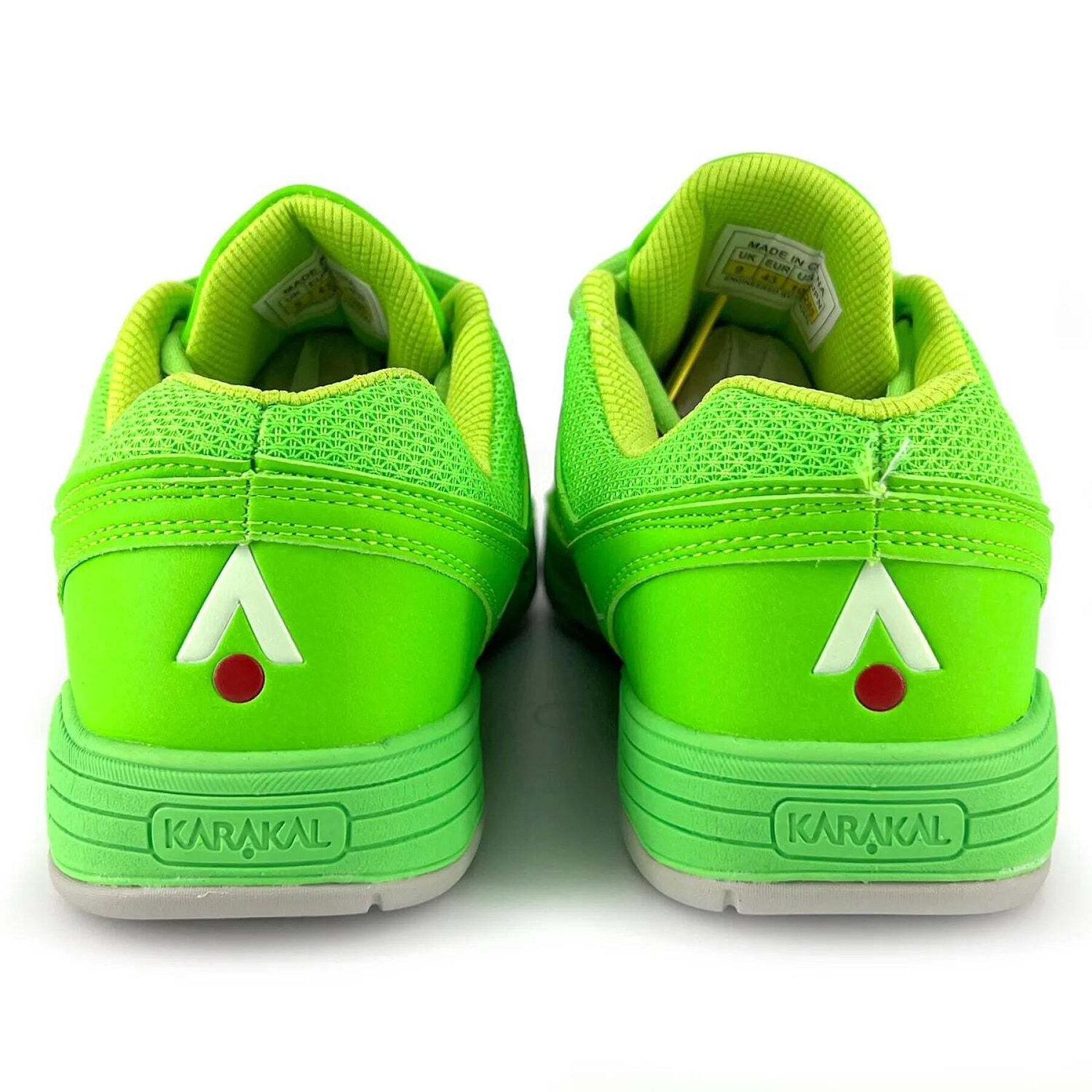 Bright sports shoes in green, featuring a white and red triangular logo on the back with "Karakal KF ProLite" branding on the heel. Tailored for badminton, they provide exceptional lateral stability. The design includes textured elements with mesh accents and visible labels inside.