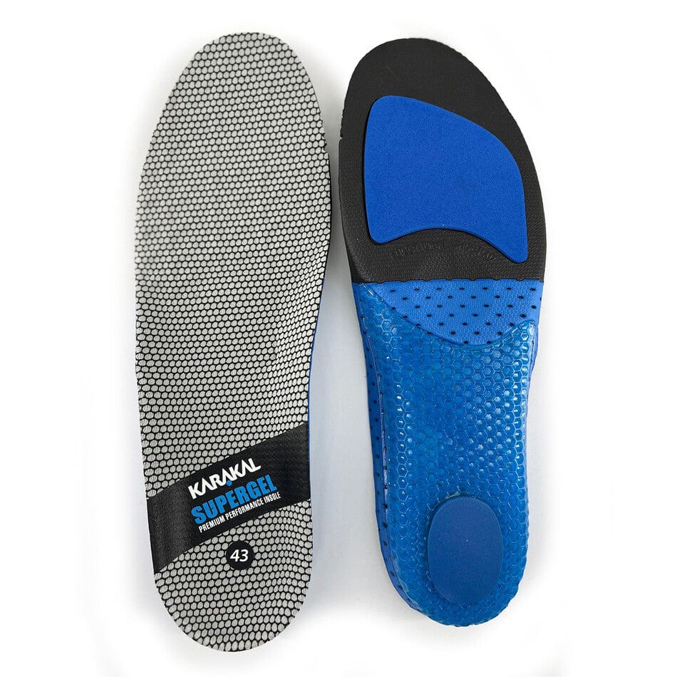 Two insoles are displayed. The first insole, designed for shock absorption, is gray with a hexagonal pattern and features the "Karakal Supergel" text. The second insole, black and blue in color, includes extra heel and arch padding to improve lateral stability and is compatible with Karakal KF Pro Lite Badminton Shoes - New Red. Both insoles are size 43.