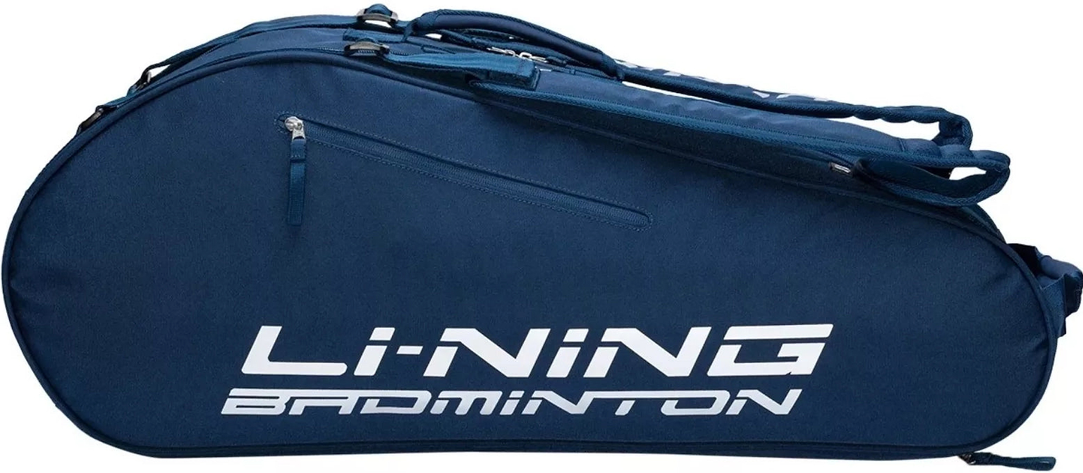 The Li-Ning Corner 6 Racket Badminton Bag - Blue features a spacious main compartment, a side zipper pocket, and an adjustable shoulder strap, with white text accenting its blue design.