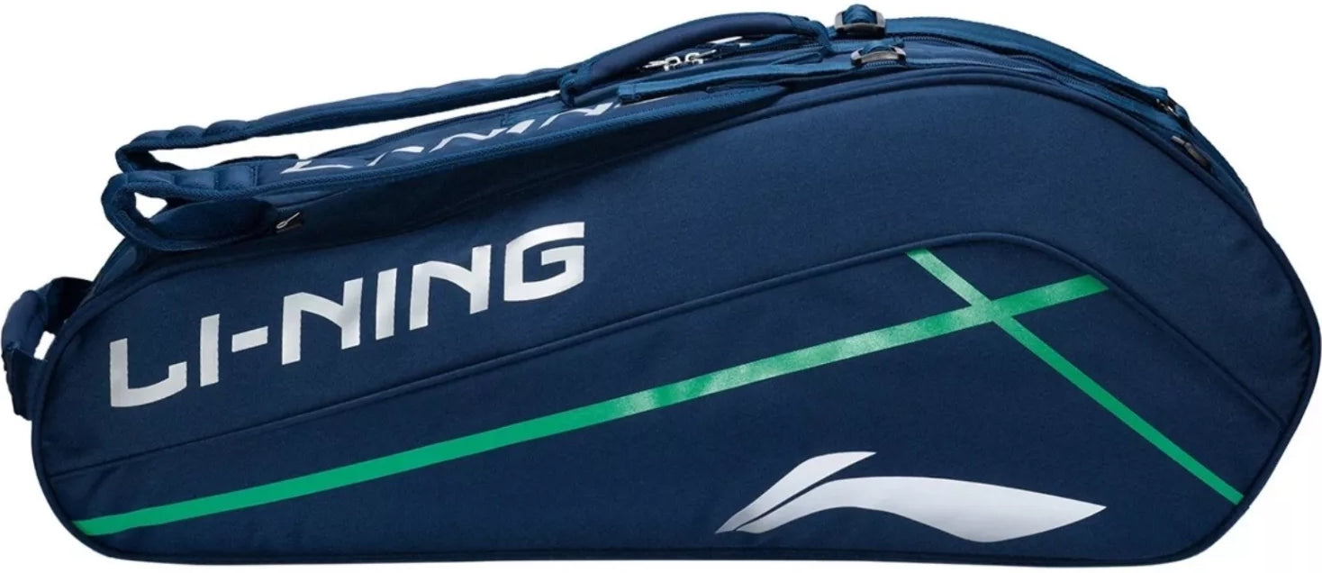 The Li-Ning Corner 6 Racket Badminton Bag - Blue is a stylish racket bag featuring a blue design with a white logo, green stripe, and white accent, perfect for carrying your badminton or tennis rackets.