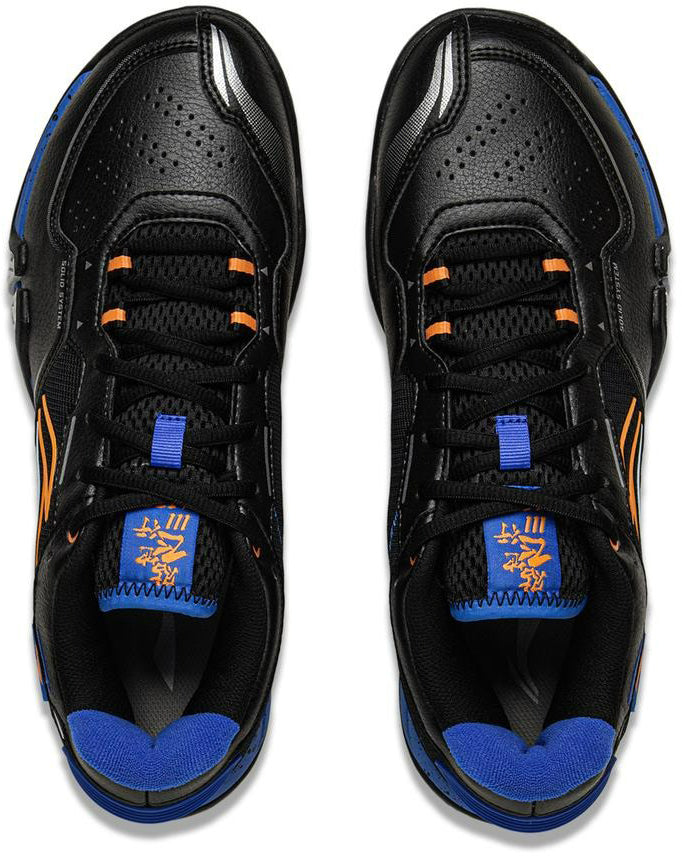 A top view of the Li-Ning Saga III Lite Mens Badminton Shoes - Black shows blue interiors, orange accents, perforated toe boxes, and blue-orange tongue designs, featuring Li-Ning Cloud cushioning for superior comfort.