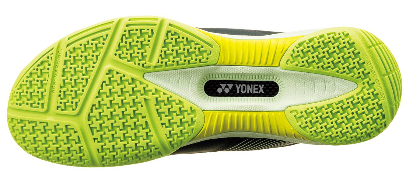 The image displays the sole of the Yonex Power Cushion 88 Dial 3 Unisex Badminton Shoes in Deep Green, featuring a yellow and green textured grip pattern with the Yonex logo at the center. This model utilizes the advanced BOA Fit System to provide a secure, customized fit ideal for high-speed badminton play.