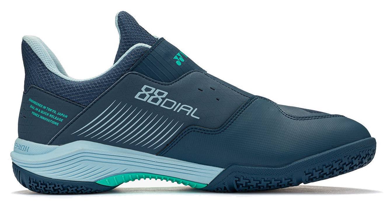 A navy and white Yonex Power Cushion 88 Dial 3 Wide unisex badminton shoe featuring light blue accents, a textured sole with “88 DIAL” printed on the side, a low-cut wide design, and equipped with the advanced BOA Fit System for quick-release tightening.