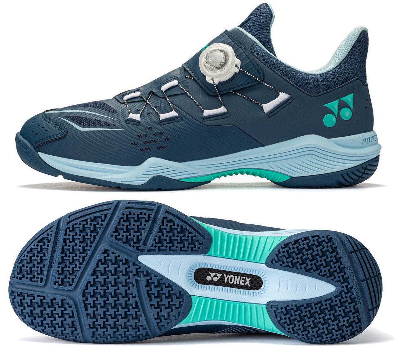A navy and white Yonex Power Cushion 88 Dial 3 Wide unisex badminton shoe featuring the advanced BOA Fit System with a white BOA dial, green accents, and a light blue and black textured sole, shown from both the side and bottom views.