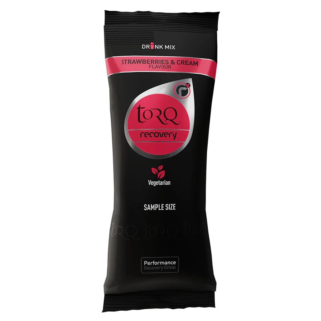 The packaging in black and red of the Torq Recovery Sachet 50g - Strawberries & Cream is a sample-sized, vegetarian-friendly beverage by Torq, crafted for post-exercise nutrition to efficiently replenish glycogen stores.