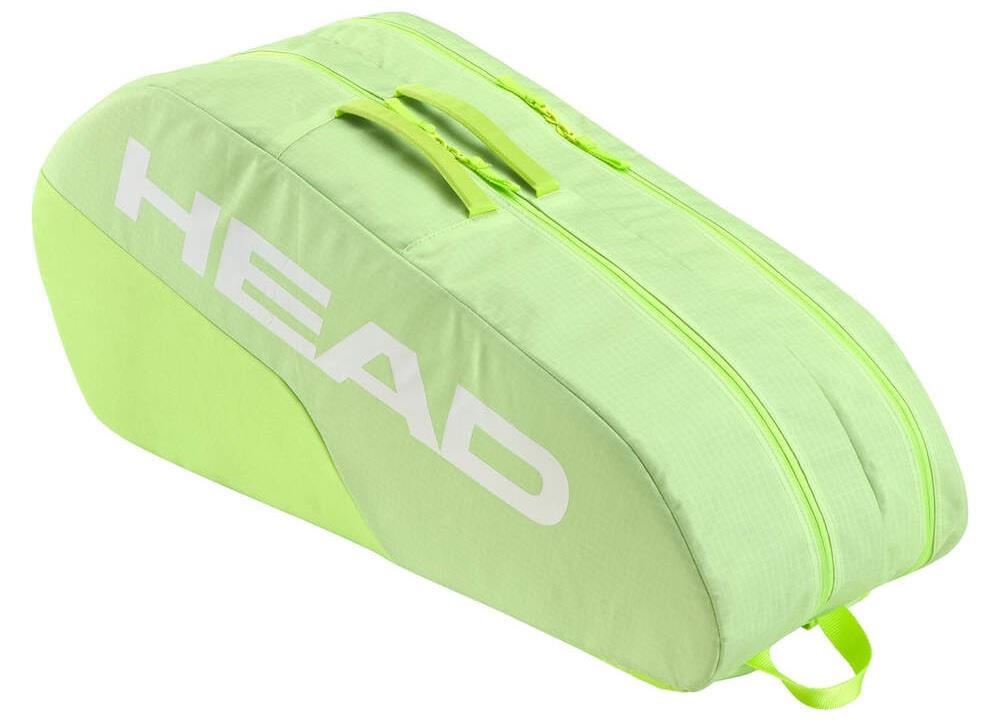 The HEAD BASE 6 Racket Badminton Bag M - SG is lime green with bold white "HEAD BASE 6" lettering, features two handles, a zipper closure, and can hold multiple rackets.