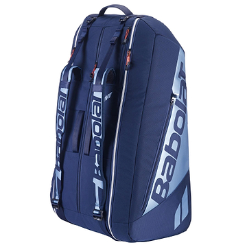 The Babolat RH12 Pure Drive Gen11 badminton bag in navy blue has multiple zipped compartments, adjustable shoulder straps, and a handle for easy carrying. It's perfect for storing your badminton or tennis rackets and gear with style and convenience.