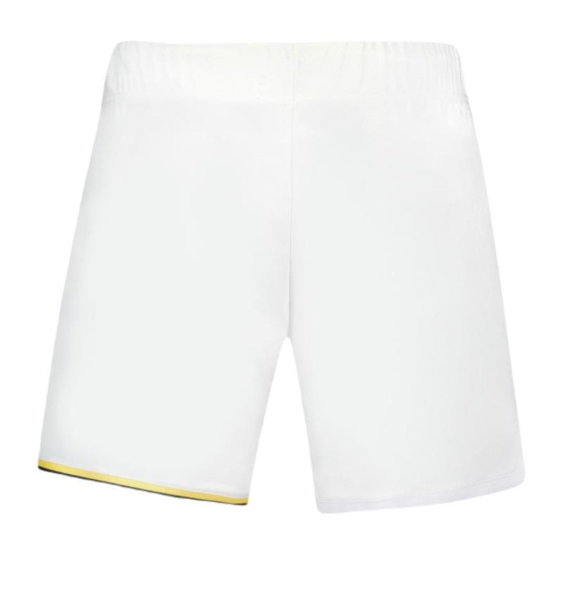 Le Coq Sportif Pro Men's Badminton Shorts in Optical White are designed with breathable fabric and an elastic waistband to keep you dry. The left side of the bottom hem features a subtle yellow and green trim, making them ideal for badminton enthusiasts. The background remains plain white.