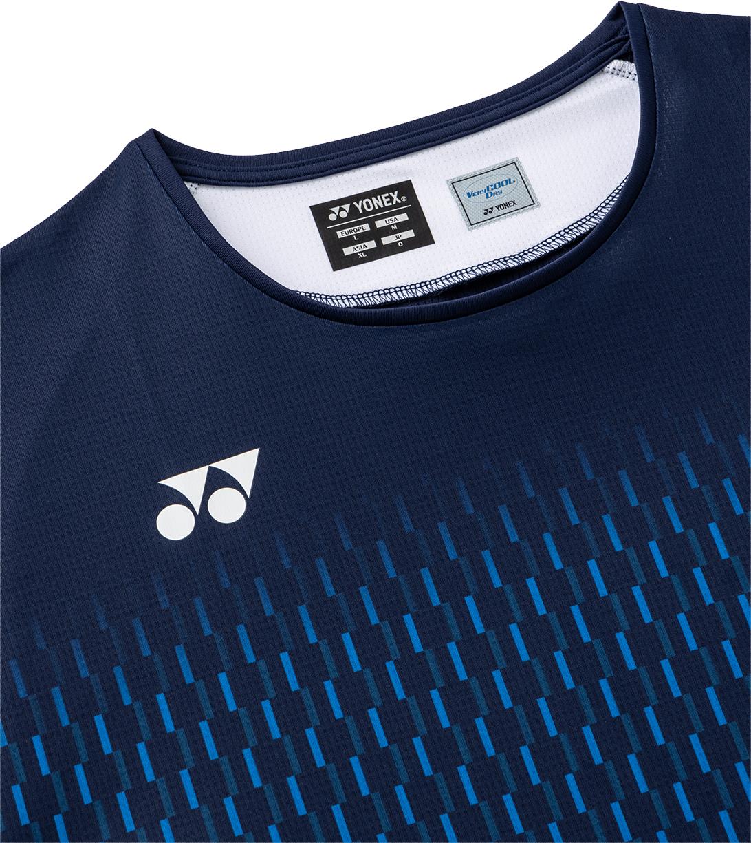 Close-up of the Yonex 10713EX Crew Neck Men's Badminton T-Shirt in dark navy, showcasing a white Yonex logo on the left chest, blue vertical lines, and a tag highlighting its moisture management sportswear design.