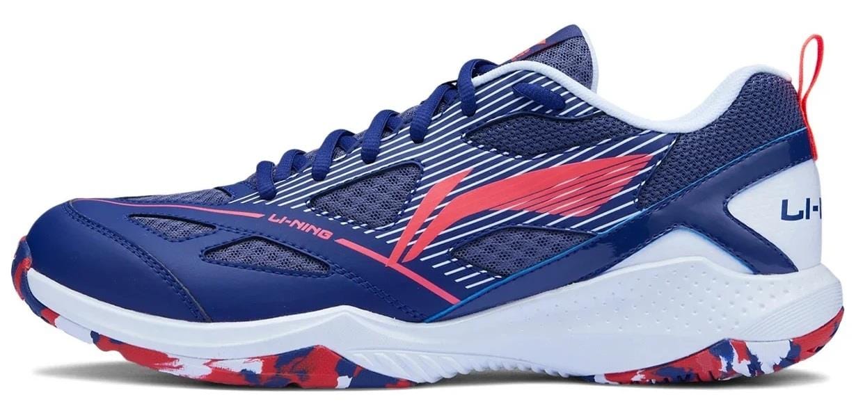 The Li-Ning Blast JF-01 Lite Unisex Badminton Shoes in blue/red feature a lightweight design, mesh panels for breathability, patterned sole, and bold LI-NING branding—ideal for stylish and agile play on the court.