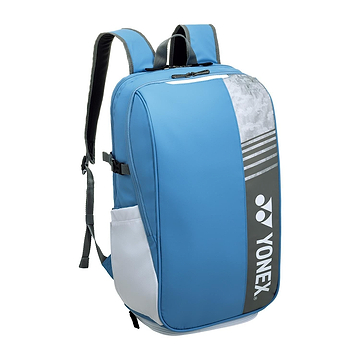 Meet the Yonex 52512EX Club Badminton Backpack in Greyish Blue. This stylish sports bag offers adjustable shoulder straps, handy side pockets, and a prominent Yonex logo on the front, making it perfect for carrying your badminton gear in style.