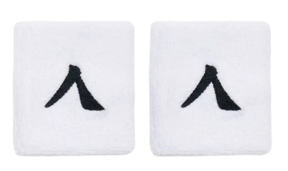 The Kanso 7cm Wristband 2 Pack in white, made from absorbent fabric, showcases a minimalist black abstract "A" logo on each band. They are displayed side by side on a plain white background.