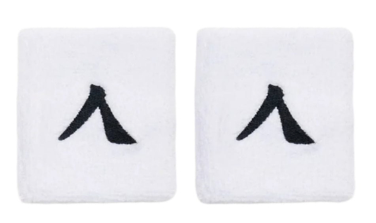 The Kanso 7cm Wristband 2 Pack in white, made from absorbent fabric, showcases a minimalist black abstract "A" logo on each band. They are displayed side by side on a plain white background.