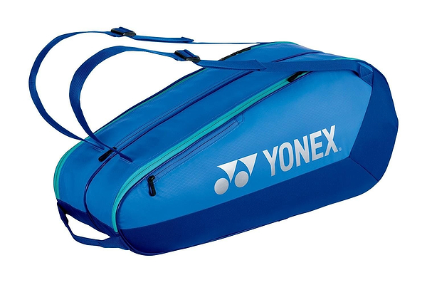 The Yonex 42526EX Team 6 Racket Badminton Bag in Blast Blue features two shoulder straps, a large zippered compartment, and a white Yonex logo on the side—ideal for tennis or versatile use as one of your badminton bags.