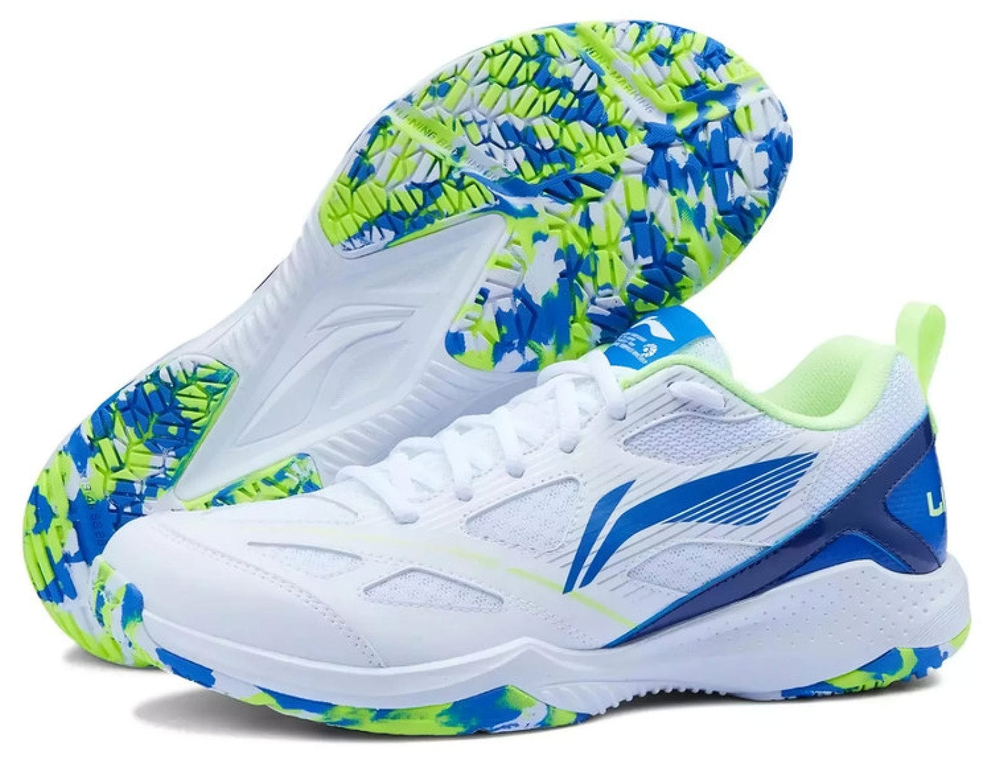 The Li-Ning Blast JF-01 Lite Unisex Badminton Shoes in white/blue/green combine a blue logo, vibrant patterned sole, lightweight build, and high-traction outsole for comfort and grip. One shoe stands upright; the other is shown on its side.