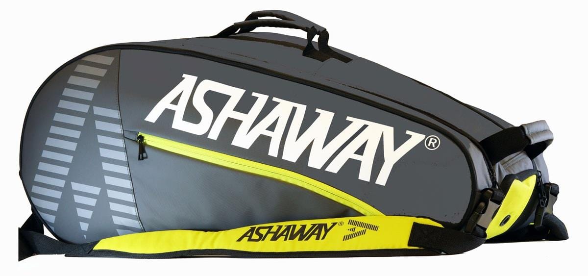 The Ashaway ATB871 Triple Thermo 9 Racket Badminton Bag in grey/yellow features large white "ASHAWAY" lettering, a zippered pocket, and a shoulder strap—ideal for carrying up to 9 rackets.