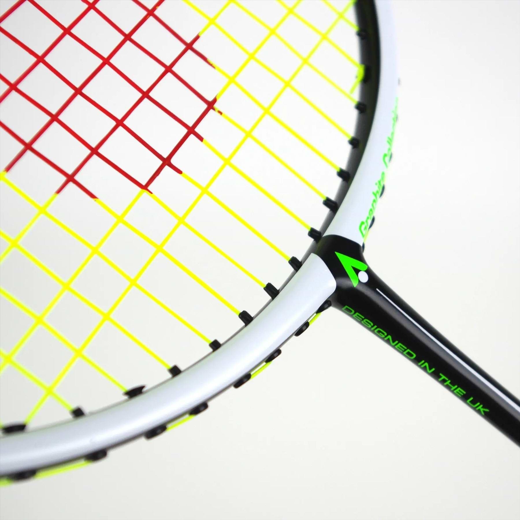 The Karakal Black Zone BZ 20 2.1 badminton racket, featuring an isometric head with a white frame and black accents, showcases red and yellow strings and the "DESIGNED IN THE UK" text on the handle. Positioned diagonally against a plain background, this high-performance racket stands out.