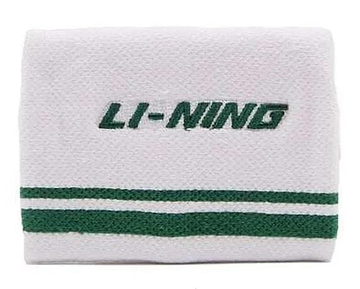 The Li-Ning Logo Wristband in white and green, featuring "LI-NING" embroidery and two parallel green stripes, is ideal for badminton players to handle perspiration during intense matches.