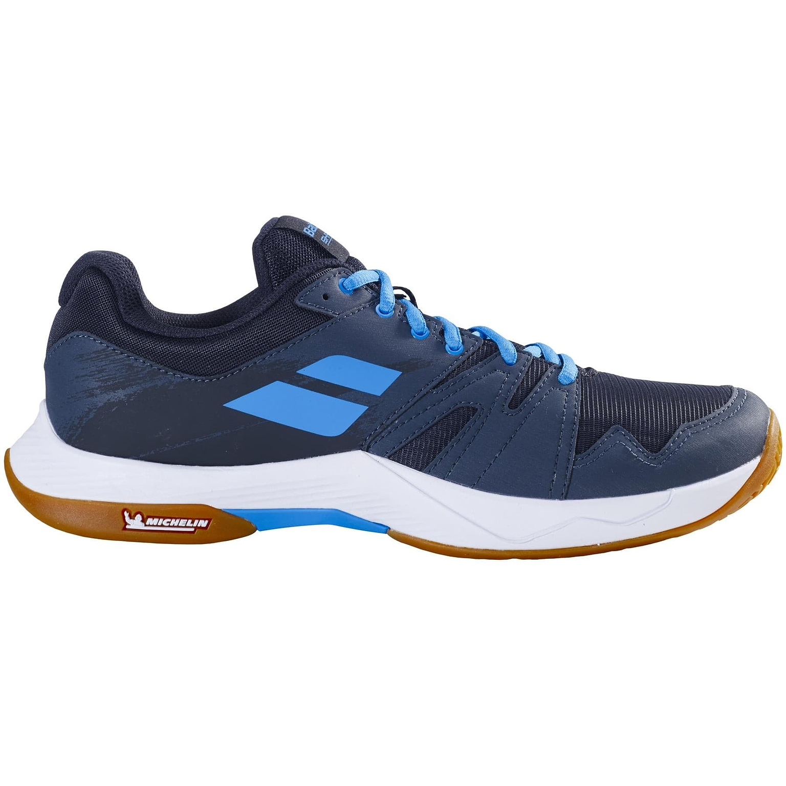The Babolat Shadow Team 2 Men's Badminton Shoes in Black/Grey feature light blue laces and accents, a white midsole, and a durable brown Michelin rubber outsole with the signature Michelin logo.