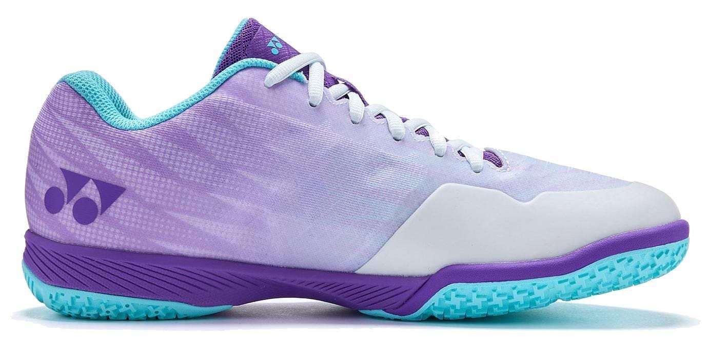 The Yonex Power Cushion Aerus Z2 Wide Mens Badminton Shoes - Indigo features a wide fit, indigo and white upper, turquoise lining and sole, purple accents, and Yonex Power Cushion for comfort. A textured turquoise outsole offers excellent grip.