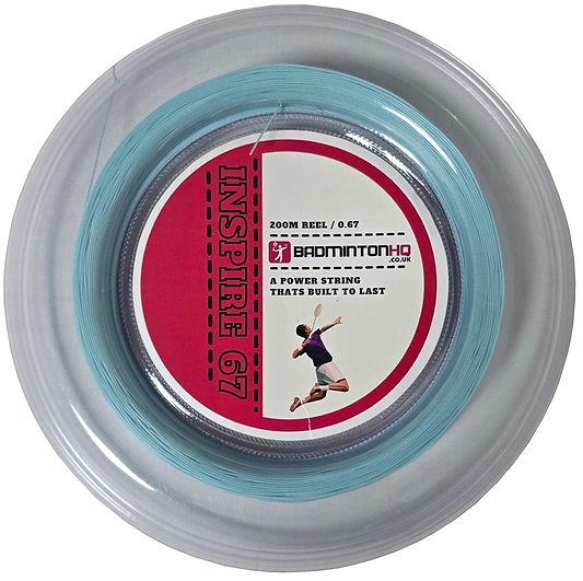 The clear round case of the BadmintonHQ Inspire 67 Zoom Light Blue badminton string (0.67mm, 200m) features a red label with a player's silhouette and the text "A power string that's built to last" from BADMINTONHQ.CO.UK. Crafted with durable nylon multifilament, it's perfect for racket stringing enthusiasts.