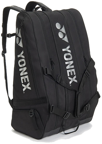 The Yonex BA726212EX Gearlogic 12 Racket Badminton Bag - Black features three zippered compartments, shoulder straps, and white Yonex logos—ideal for securely carrying all your badminton gear to tournaments.
