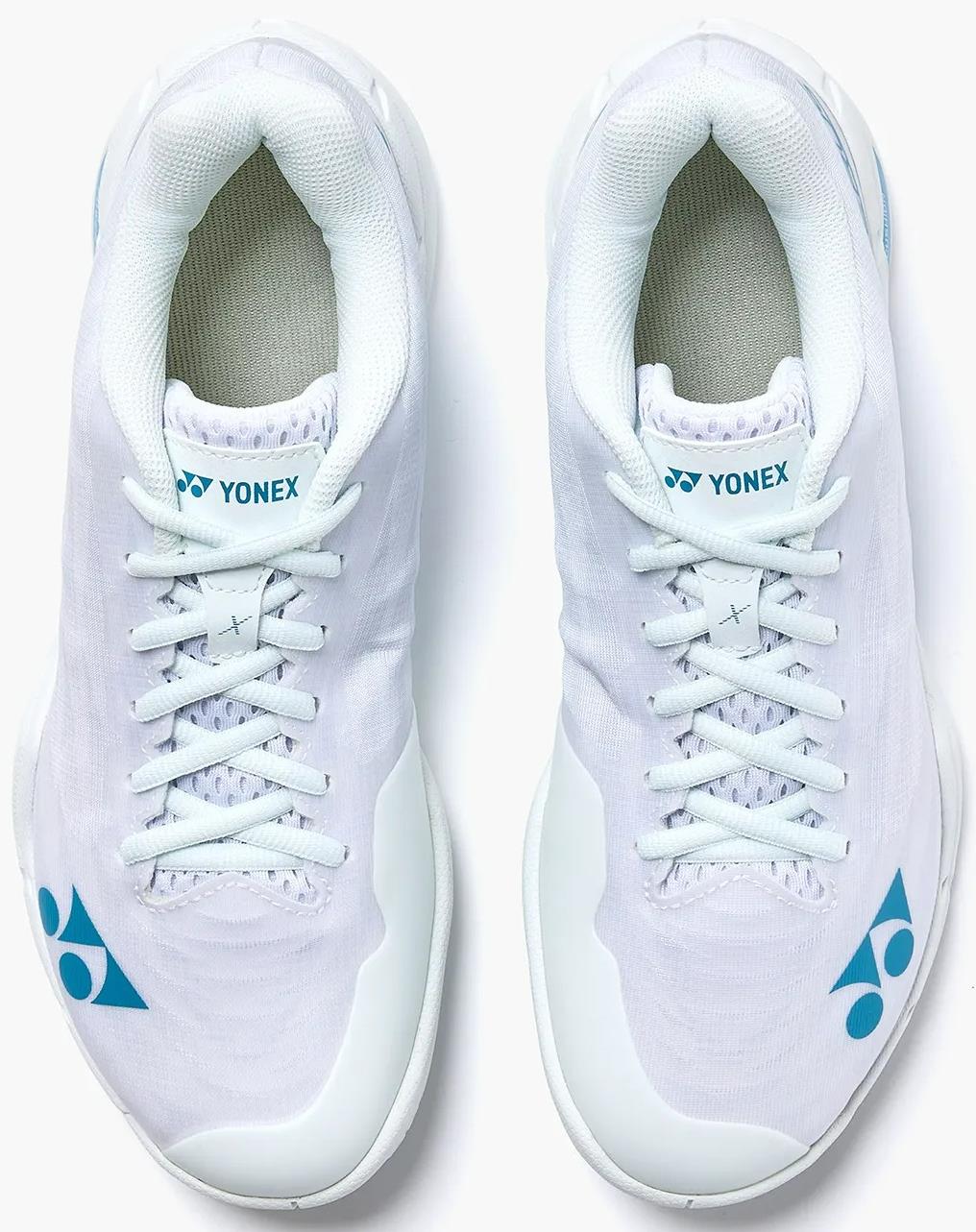 A pair of Yonex Power Cushion Aerus X2 Unisex Badminton Shoes in white with blue Yonex logos near the toes and on the tongue are neatly laced, shown from above against a plain background.