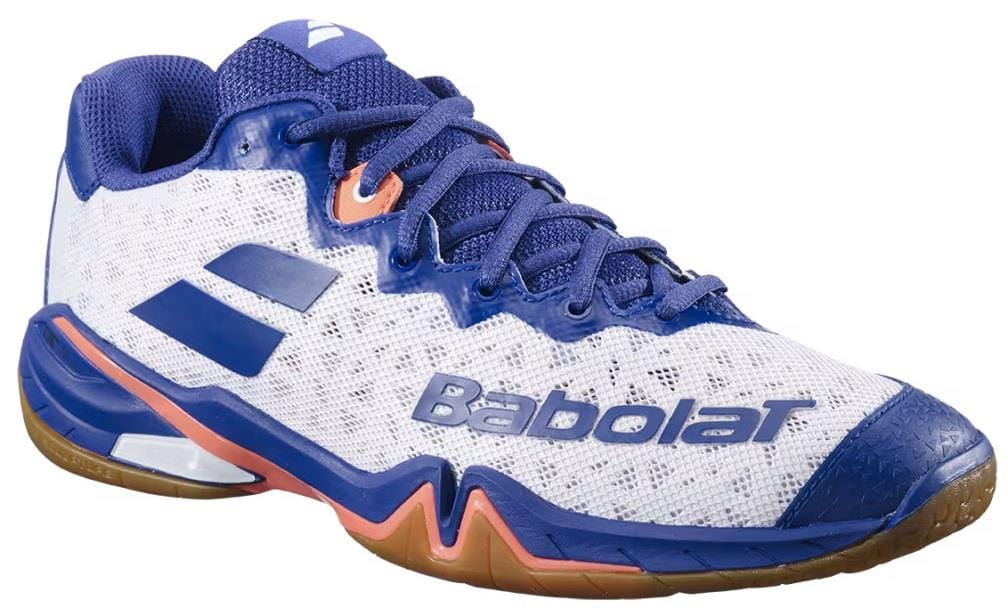 The Babolat Shadow 4 Men's Badminton Shoes in white, blue, and navy feature a wave-patterned sole, mesh upper, and bold side logo—ideal for players seeking style and performance.