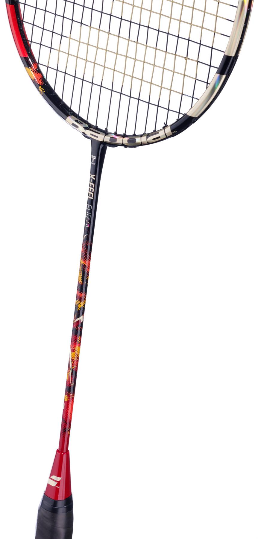A close-up of the Babolat X-Feel Spark 2026 3U Badminton Racket in red, featuring a patterned black, red, and yellow shaft and black grip, is shown against a white background to highlight its power potential.