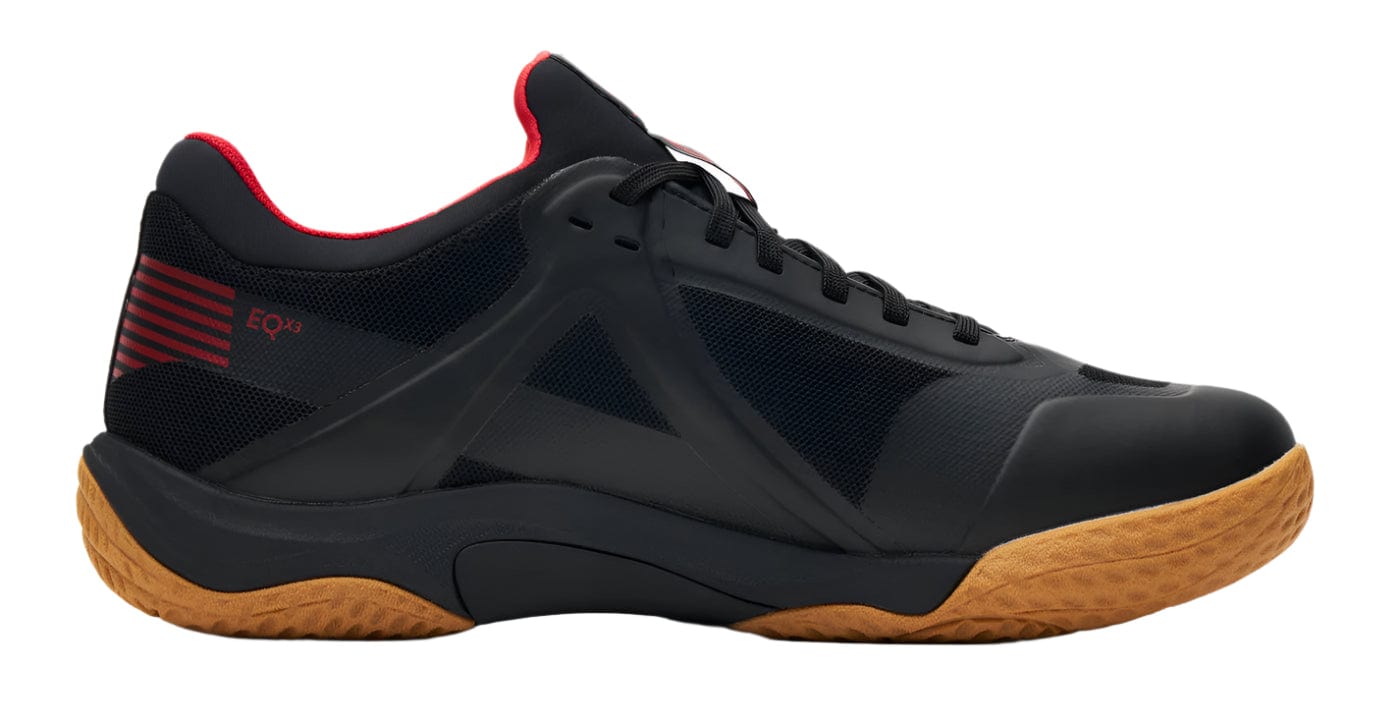 Introducing the Kanso Equilibrium EQx3 Unisex Badminton Shoes: black athletic footwear with a mesh and leather upper, red accents, a red interior, and a tan textured sole. Featuring Speedlight foam for superior comfort, they have a low-top silhouette with distinct EQ branding.