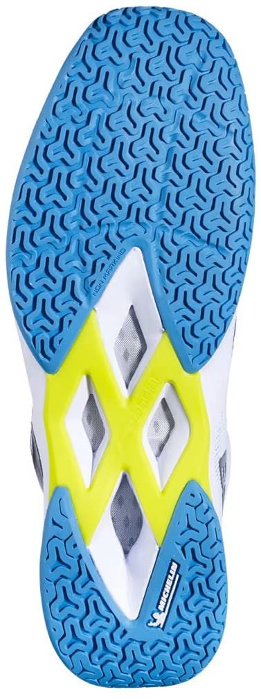 The image shows the sole of a Babolat Shadow Spirit 2 Mens Badminton Shoe in White/Algier Blue, featuring a blue textured grip, yellow mid accents, white areas, and the Michelin outsole logo at the bottom right. Brand: Babolat.