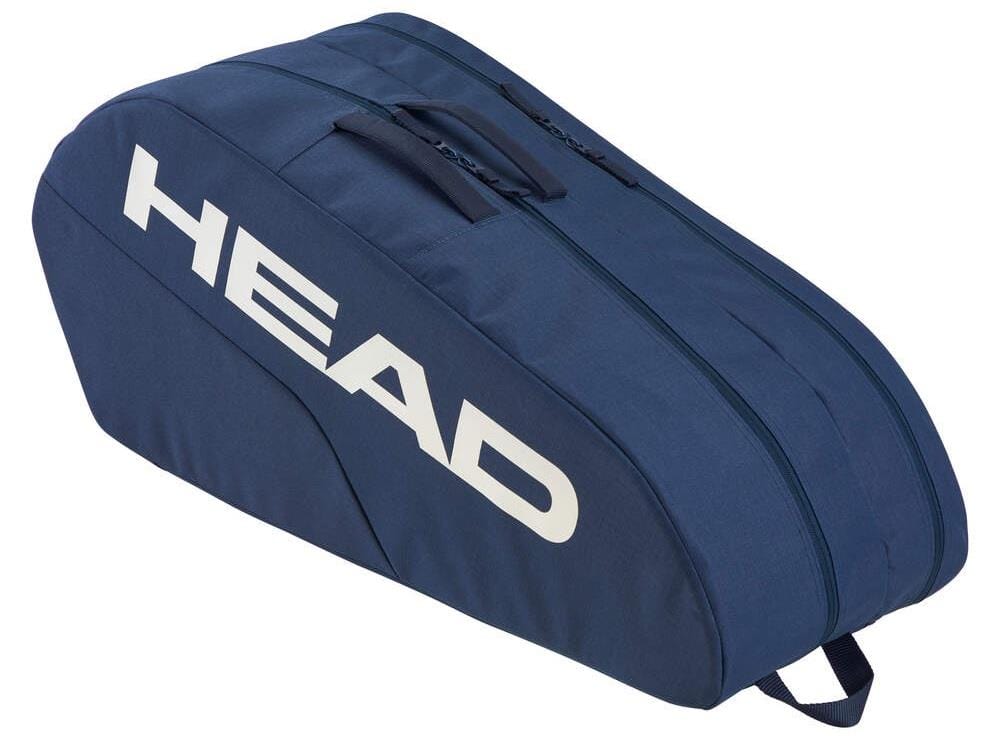 The HEAD BASE 6 Racket Bag M - NV, in blue, features a sleek design with a top handle. "HEAD" is prominently printed in white on the side. Its reinforced construction with dual zippers holds up to six rackets—perfect for tennis or badminton enthusiasts.