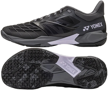 The Yonex Power Cushion Cascade Drive 3 Unisex Badminton Shoes in Black/Grey are shown from the side and bottom, with a textured upper, detailed tread, gray sole with Power Cushion tech, and Yonex branding.