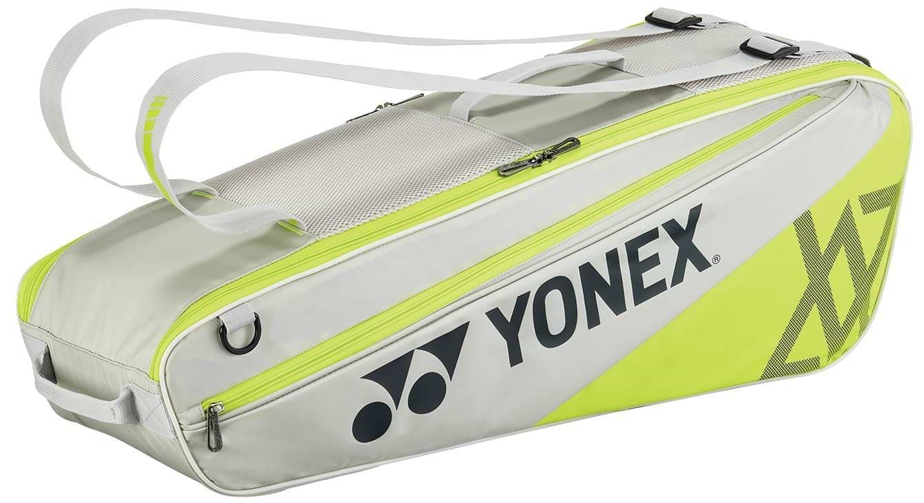 The Yonex 52526VA Viktor Axelsen 6 Racket Badminton Bag in greyish beige features a large Yonex logo, zippered side pocket, double shoulder straps, and a mesh top section. Inspired by the Viktor Axelsen Signature series.