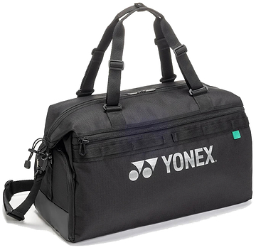 The Yonex BA72611EX Gearlogic Badminton Boston Bag in black is made from recycled polyester, with double handles, a detachable shoulder strap, zippered compartments, and a white Yonex logo on the side.