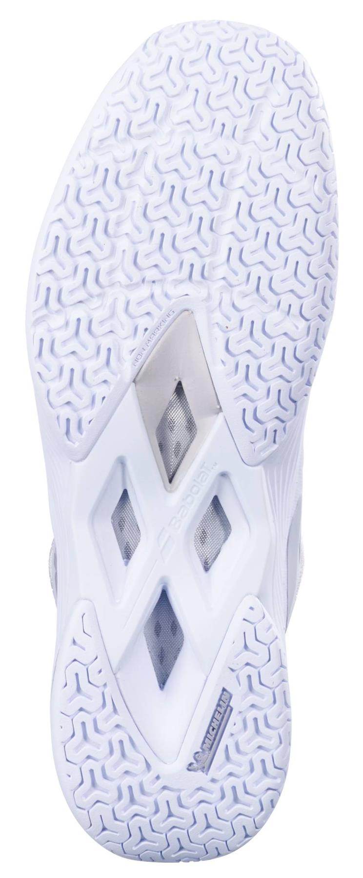 A close-up of the white sole on the Babolat Shadow Tour 5 Womens Badminton Shoes shows its patterned tread, triangular ventilation holes, and the Michelin logo by the heel.