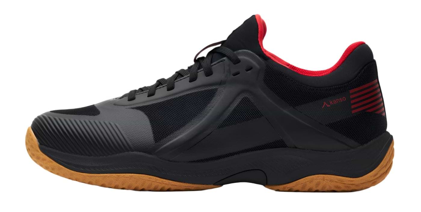 The Kanso Equilibrium EQx3 Unisex Badminton Shoes in black feature a gum sole, subtle red accents at the ankle collar, mesh panels, and Speedlight foam cushioning for a sleek, modern design ideal for badminton or casual wear.