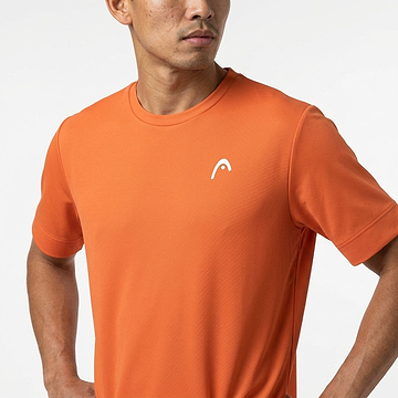 A man wearing a HEAD Slice II Mens Badminton T-Shirt - CN by HEAD, crafted with moisture transfer microfiber, stands against a plain white background with his hands on his hips.