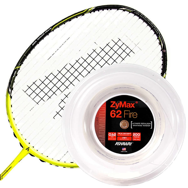 A yellow and black badminton racket is placed beside a reel of Ashaway Zymax 62 Fire Badminton String in white, known for its maximum repulsion prized by professional players, with the label displaying specifications in white, red, and black text.