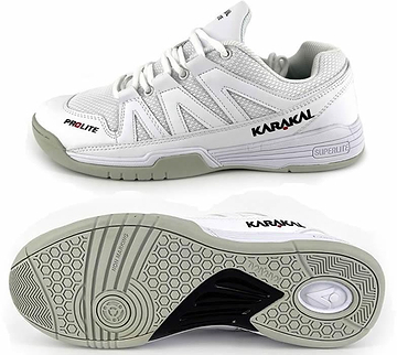 Introducing the Karakal KF Pro Lite Badminton Shoes in White, designed for lateral stability. The top shoe showcases the "Karakal" and "Prolite" brand logos on the side. The bottom shoe is equipped with a textured sole featuring a honeycomb pattern and circular design, offering enhanced comfort with its shock-absorbing gel insole.