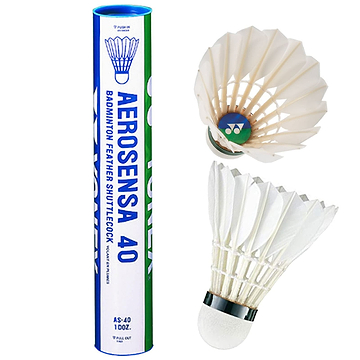 A tube containing Yonex Aerosensa AS40 badminton feather shuttlecocks is displayed alongside two shuttlecocks. One shuttlecock remains inside the tube, which features a blue and green label, while the other is shown separately, emphasizing its pristine white goose feathers.