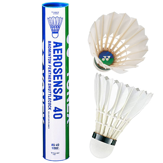A tube containing Yonex Aerosensa AS40 badminton feather shuttlecocks is displayed alongside two shuttlecocks. One shuttlecock remains inside the tube, which features a blue and green label, while the other is shown separately, emphasizing its pristine white goose feathers.