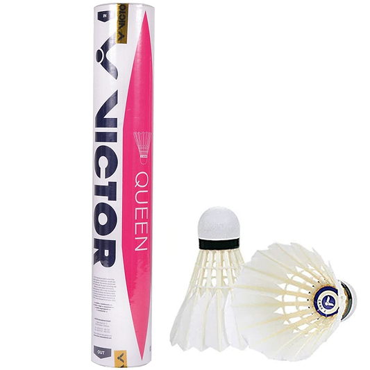 A durable, white and pink tube of "VICTOR Queen Feather Shuttles" by Victor stands upright beside two duck feather shuttlecocks, one positioned on its side and the other upright. These shuttlecocks feature a cork base to enhance flight stability.