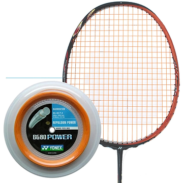 A Yonex BG 80P Badminton Racket with bright orange strings is displayed alongside a close-up of a 200m reel of Yonex BG 80P badminton string. This string, known for its high repulsion power and Vectran fiber for a hard feel, comes in vibrant orange packaging that highlights its outstanding performance and quality.