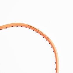 Close-up of a partial frame of the Li-Ning Windstorm 72 6U Badminton Racket in orange, set against a white background. The top right corner, featuring string holes, is visible along the edge, showcasing its head-heavy balance designed for powerful shots.
