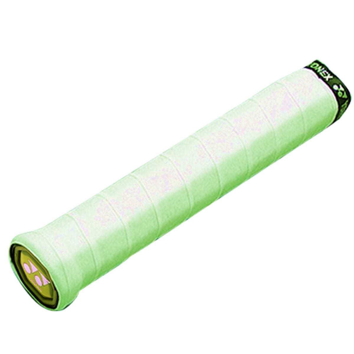 The Yonex AC102EX Super Grap Badminton Overgrip in green, offered in a 3-pack, has a textured surface to improve sweat absorption. It wraps snugly around the racket handle and is finished with a black cap featuring a yellow Yonex logo.