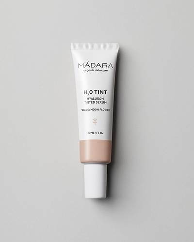 MÁDARA Organic Skincare hyaluron tinted serum moon flower A3512 serum product photo on plain background.