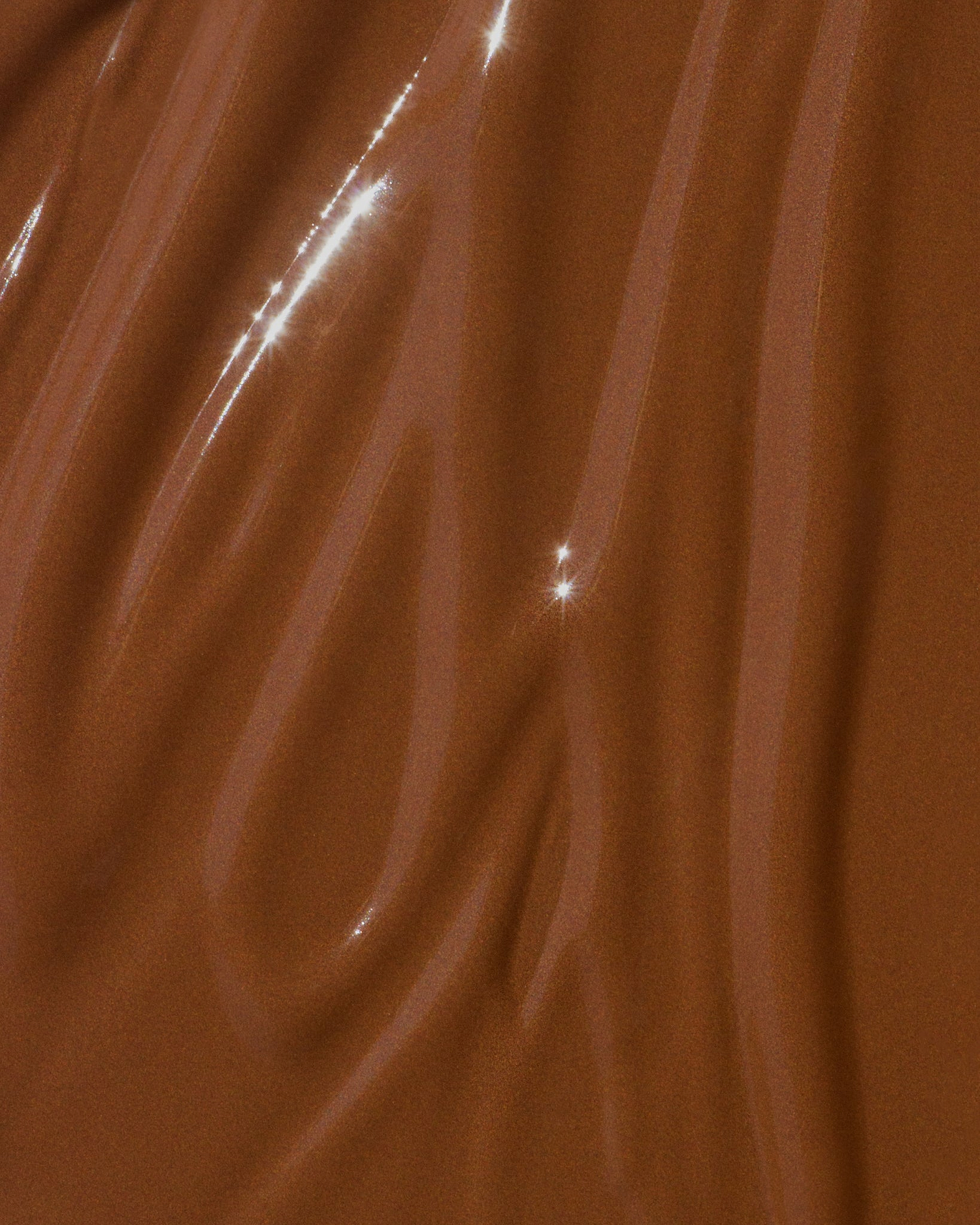 Texture close-up of MÁDARA Organic Skincare skin equal chestnut A6067 �swatch demonstrates consistency and finish.