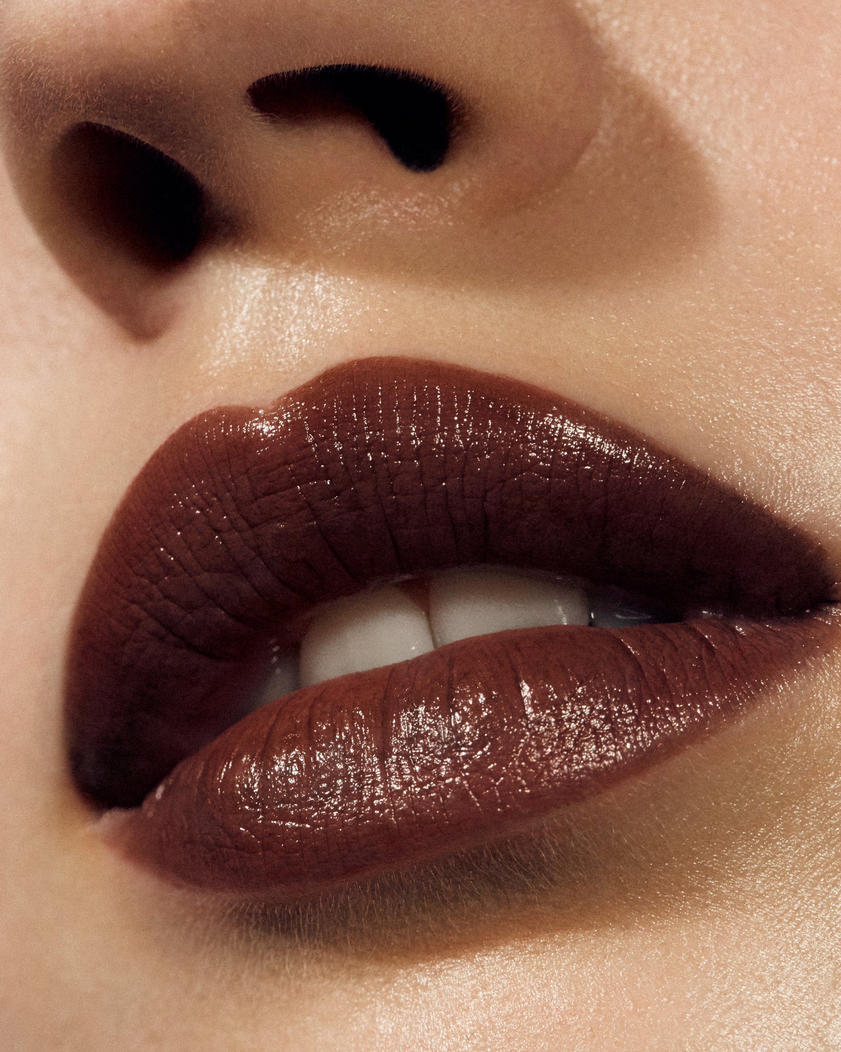 Model wearing MÁDARA Organic Skincare satin shine lipstick dominance on A6504 on skin; close-up portrait shows natural application results.